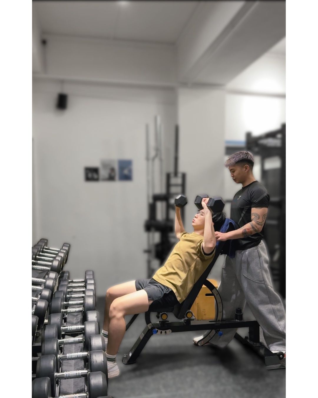 Fred spotting a client on an incline dumbbell press.