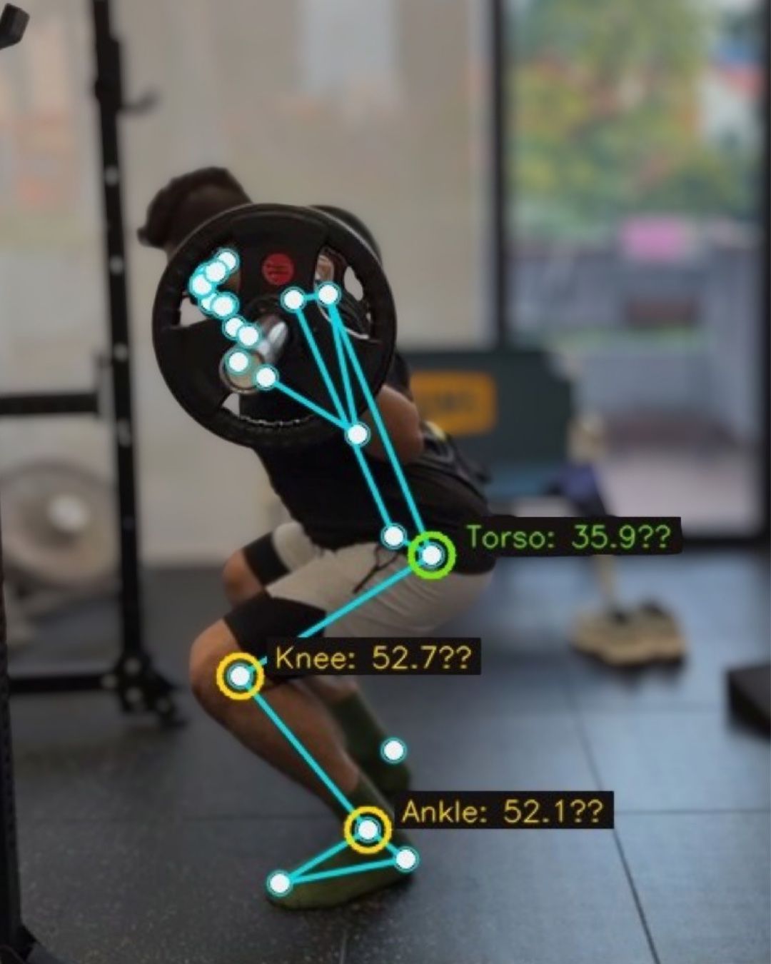 A squat with joint angles overlaid: torso, knee and ankle.